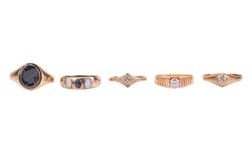 Lot Five gem-set rings; including a diamond...