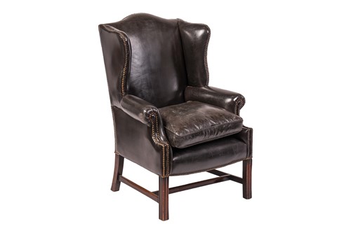 Lot A George III-style hide-covered fireside wing...