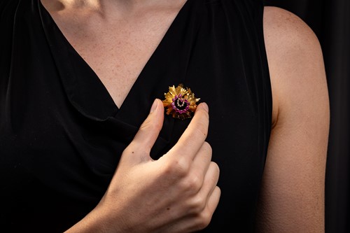 Lot A Modernist brooch set with pink sapphire and...