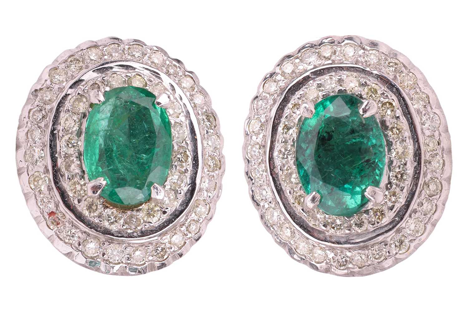Lot A pair of emerald and diamond cluster earrings,...