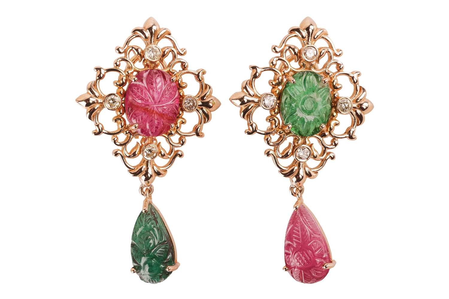 Lot 323 - A pair of drop earrings set with carved...