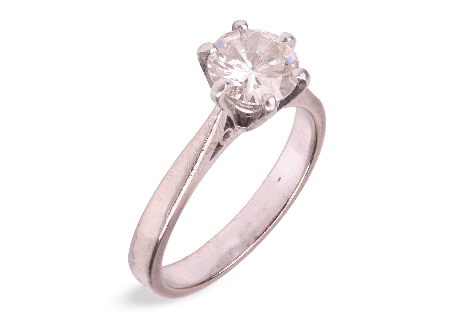 Lot A diamond solitaire ring, claw-set with a...