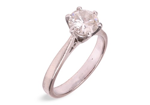 Lot A diamond solitaire ring, claw-set with a...