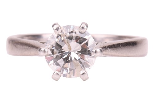 Lot A diamond solitaire ring, claw-set with a...