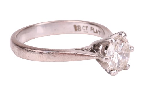 Lot A diamond solitaire ring, claw-set with a...
