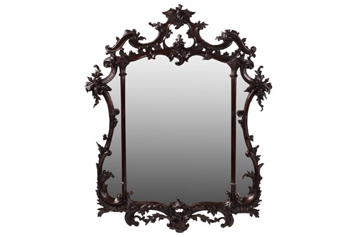 Lot A carved mahogany George III-style Rococo...