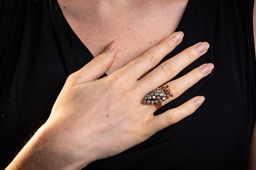 Lot 18 - A diamond and ruby cocktail ring, in the form...