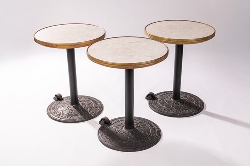 Lot 24 - Three outdoor cast iron and marble-topped...