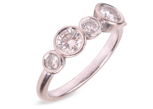 Lot A diamond half-hoop ring, with an estimated...