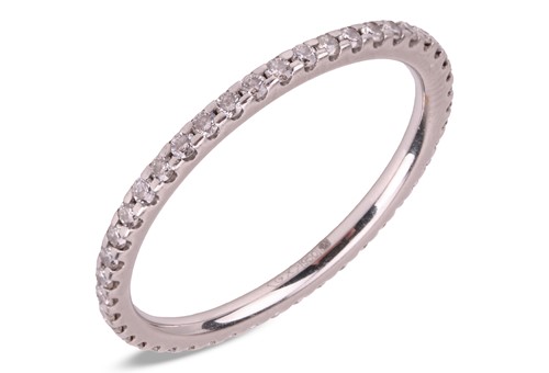 Lot A diamond eternity ring in platinum, the thin...