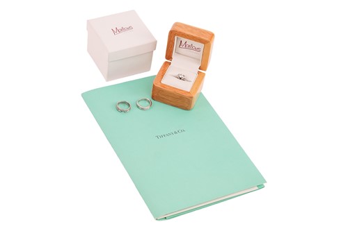 Lot Tiffany & Co. - a diamond ribbon solitaire...