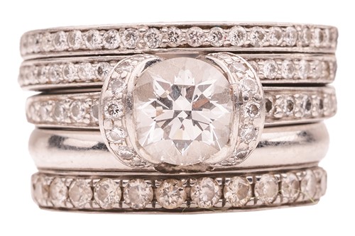 Lot Tiffany & Co. - a diamond ribbon solitaire...