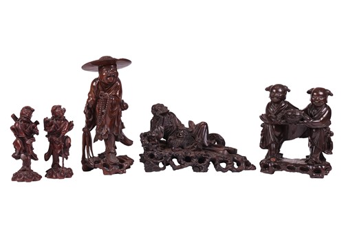 Lot 281 - A group of five Chinese hardwood carvings in...
