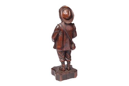 Lot 293 - A stained softwood carved figure of Sancho...