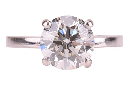 Lot A diamond solitaire ring in 18ct white gold,...