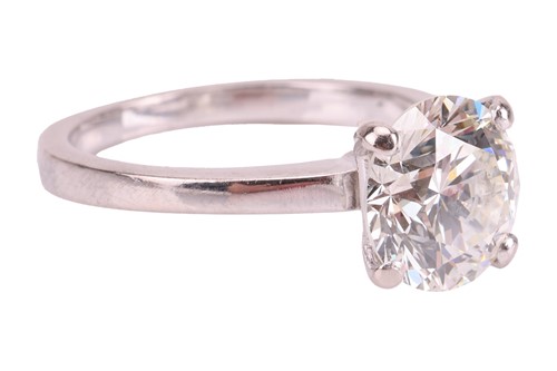 Lot A diamond solitaire ring in 18ct white gold,...