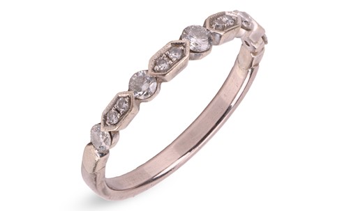 Lot A diamond-set half eternity ring, with an...
