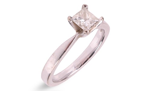 Lot A princess-cut diamond solitaire ring in 18ct...
