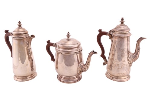 Lot A matched three-piece silver coffee/tea set,...