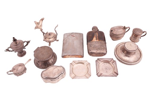 Lot 80 - An Art Deco silver hip flask by Dunhill; the...
