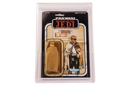 Lot Star Wars: a vintage Kenner Prune Face carded...