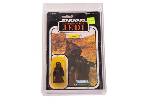 Lot Star Wars: a vintage Kenner Jawa carded figure,...