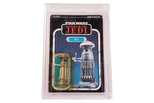 Lot Star Wars: a vintage Kenner FX-7 carded figure,...