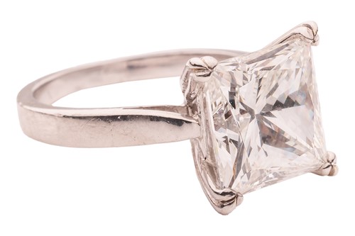 Lot A princess-cut diamond solitaire ring,...