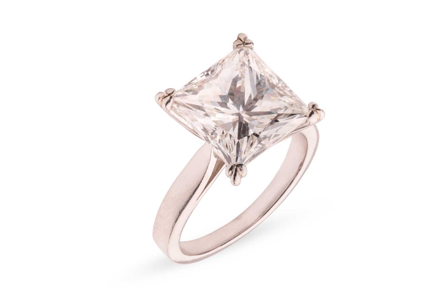 Lot A princess-cut diamond solitaire ring,...