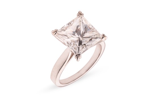 Lot A princess-cut diamond solitaire ring,...