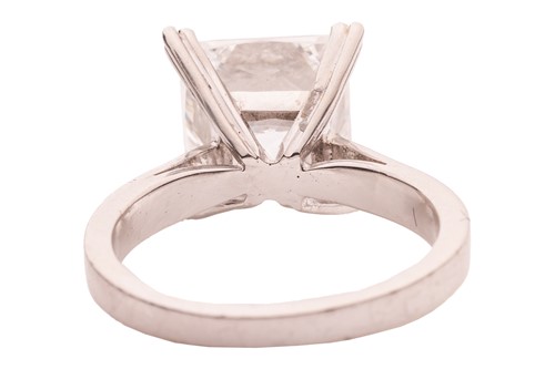 Lot A princess-cut diamond solitaire ring,...