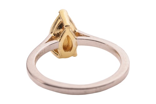 Lot A pear-cut fancy yellow diamond solitaire ring,...