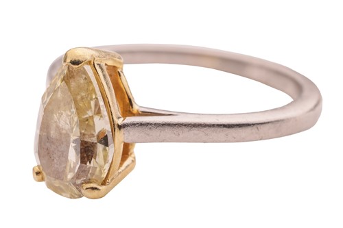 Lot A pear-cut fancy yellow diamond solitaire ring,...