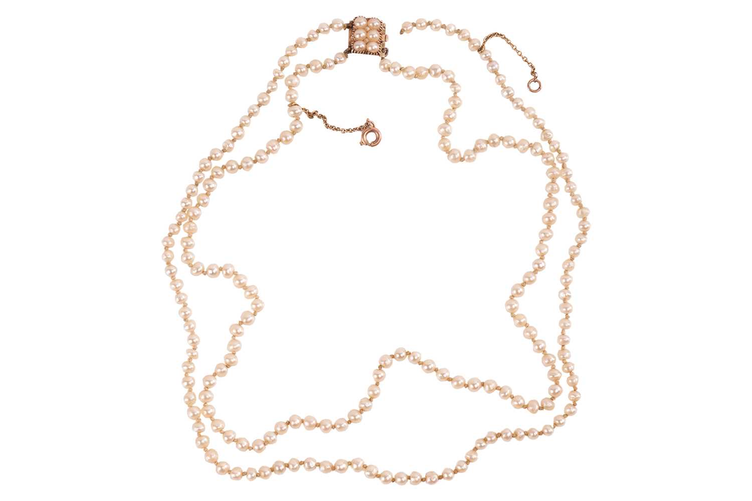 Lot 134 - A double-row natural saltwater pearl necklace,...