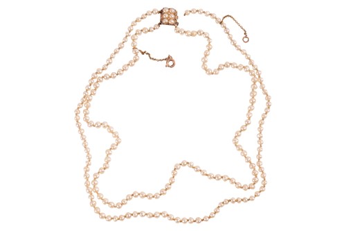 Lot 134 - A double-row natural saltwater pearl necklace,...