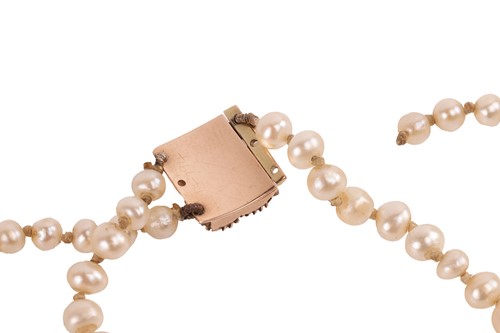 Lot 134 - A double-row natural saltwater pearl necklace,...