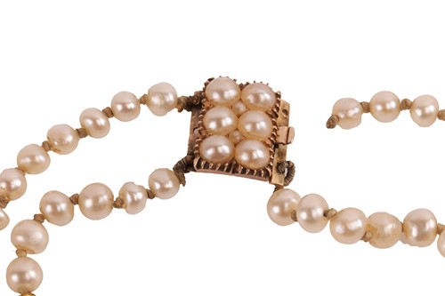 Lot 134 - A double-row natural saltwater pearl necklace,...