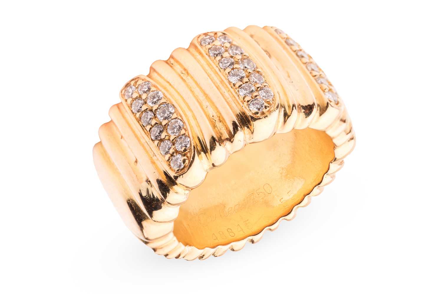 Lot Cartier - a diamond-set "Casque D'or" ring,...