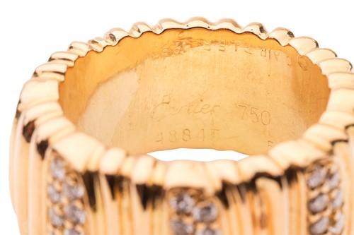 Lot Cartier - a diamond-set "Casque D'or" ring,...