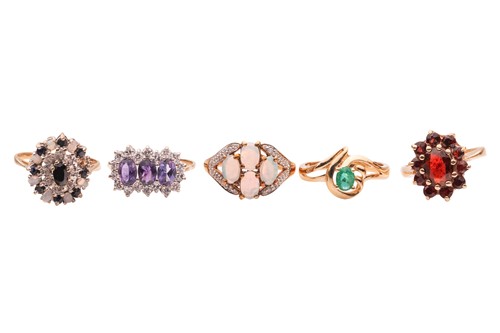 Lot 50 - A group of five gem-set rings; The first an...