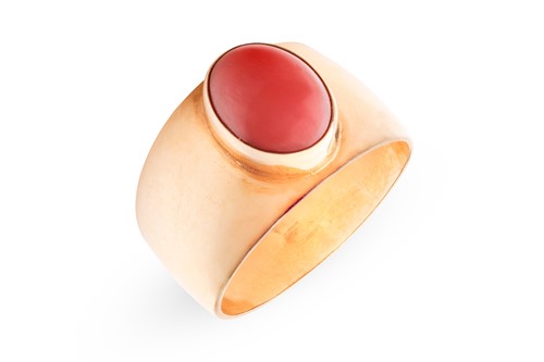 Lot 178 - A coral dress ring, collet-set with an oval...