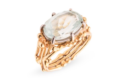 Lot 133 - An aquamarine dress ring, of organic abstract...