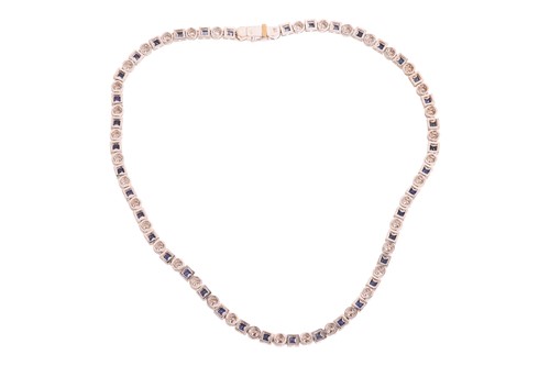 Lot A diamond and sapphire riviere necklace in...