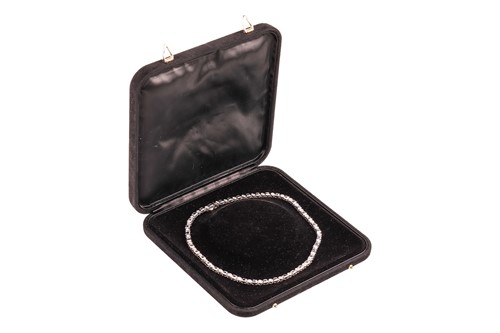 Lot A diamond and sapphire riviere necklace in...
