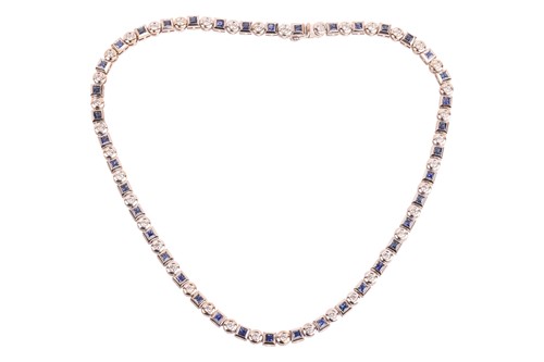 Lot A diamond and sapphire riviere necklace in...