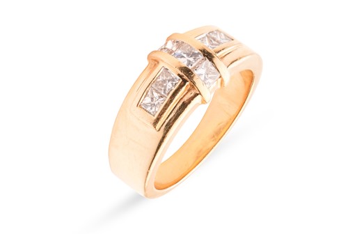 Lot 256 - A dress ring set with princess-cut diamonds,...