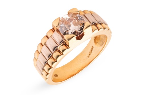 Lot 281 - A diamond solitaire ring in 18ct bi-coloured...