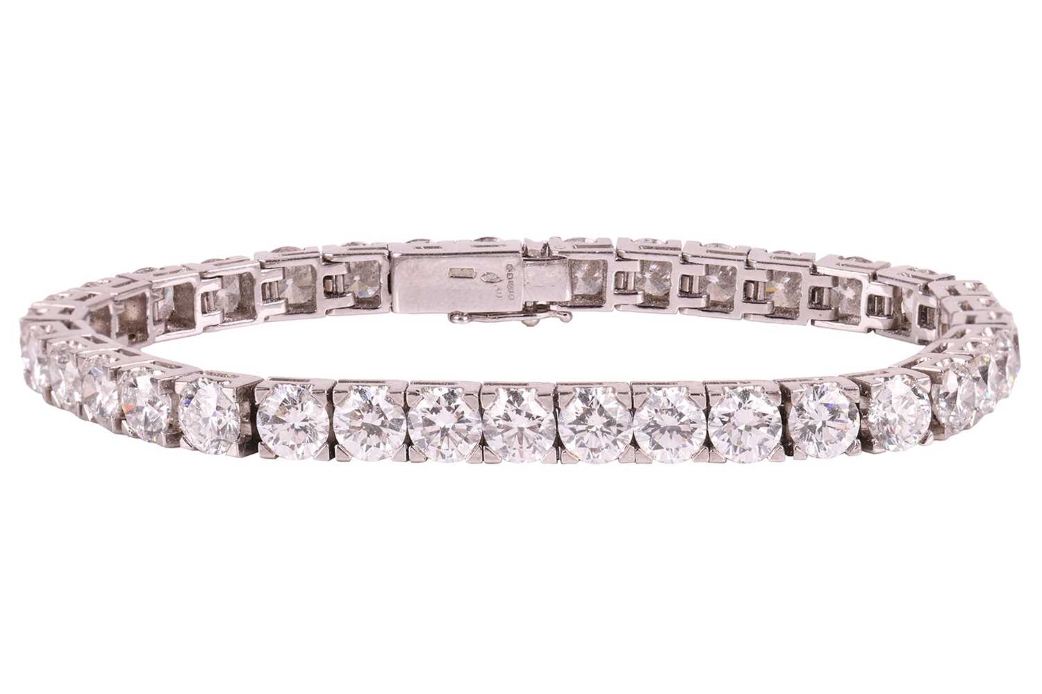 Lot 126 - An impressive diamond-set line bracelet, with...