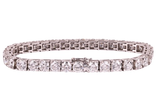 Lot 126 - An impressive diamond-set line bracelet, with...