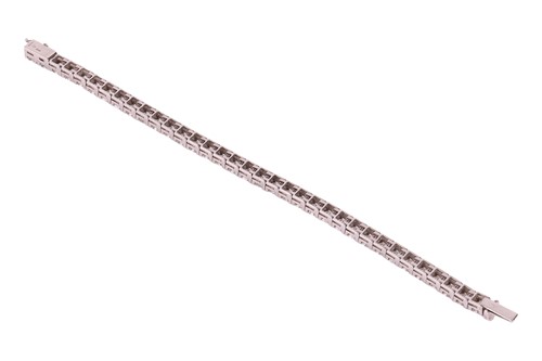 Lot 126 - An impressive diamond-set line bracelet, with...